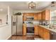 Updated kitchen features stainless appliances, granite countertops, and dark wood flooring at 10804 Bounty St, New Port Richey, FL 34654
