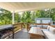 Relaxing covered patio with outdoor seating and a scenic backyard view at 10804 Bounty St, New Port Richey, FL 34654