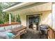 Covered patio with a BBQ grill and outdoor seating, perfect for entertaining at 10804 Bounty St, New Port Richey, FL 34654