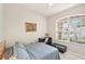 Comfortable bedroom with natural light, a ceiling fan, a desk, and a serene atmosphere at 10905 Wildcat Dr, Riverview, FL 33579
