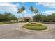 Community entrance with beautiful landscaping and elegant clubhouse at 10905 Wildcat Dr, Riverview, FL 33579