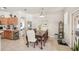 Bright dining area with a view of the backyard, seamlessly connected to the kitchen and living spaces at 10905 Wildcat Dr, Riverview, FL 33579