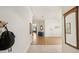Bright foyer with hardwood floors and neutral walls create a welcoming and spacious entry at 10905 Wildcat Dr, Riverview, FL 33579