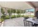 Relaxing screened patio area, ideal for entertaining with backyard views at 10905 Wildcat Dr, Riverview, FL 33579