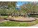 Well-maintained playground with slides, climbing structures, and soft ground cover for safety at 10905 Wildcat Dr, Riverview, FL 33579