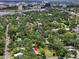 Expansive aerial view of the lush, tree-filled neighborhood and cityscape surrounding the property's location at 111 29Th W St, Bradenton, FL 34205