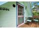 This inviting balcony features a charming table and chairs, perfect for enjoying outdoor relaxation at 111 29Th W St, Bradenton, FL 34205