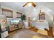 Sunlit bedroom boasting hardwood floors, complemented by stylish decor and ample natural light at 111 29Th W St, Bradenton, FL 34205