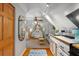 Cozy bedroom with white shiplap walls, complemented by a kitchenette for added convenience at 111 29Th W St, Bradenton, FL 34205