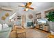 Inviting living room with hardwood floors, complemented by a comfortable couch and modern amenities at 111 29Th W St, Bradenton, FL 34205