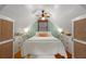 Stylish primary bedroom with built-in dressers, hardwood floors, and a tranquil ambiance at 111 29Th W St, Bradenton, FL 34205