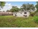 The spacious backyard features a patio area, grill, and plenty of room for outdoor activities at 11320 125Th Ter, Largo, FL 33778