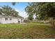 The property features a large, grassy backyard, a patio, grill, and a wood fence at 11320 125Th Ter, Largo, FL 33778