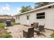 The backyard features a patio with outdoor seating and a grill at 11320 125Th Ter, Largo, FL 33778