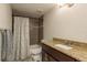 Clean bathroom featuring granite countertops and shower with tile at 11320 125Th Ter, Largo, FL 33778