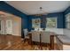 Cozy dining area with unique lighting and seating with lovely backyard view at 11320 125Th Ter, Largo, FL 33778
