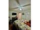 Comfortable bedroom with ceiling fan, neutral walls, and a closet for storage at 11521 Paperwood Pl, Riverview, FL 33579