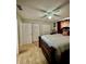 Bedroom featuring neutral walls, tile flooring, and a well-sized closet at 11521 Paperwood Pl, Riverview, FL 33579