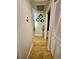 Hallway featuring tile floors, and a closet, leading to other areas of the home at 11521 Paperwood Pl, Riverview, FL 33579