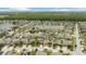 Aerial view of 12026 Crestridge Loop in New Port Richey, FL, within a leafy suburban community at 12026 Crestridge Loop, New Port Richey, FL 34655