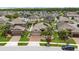 An elevated street view of a single-story home with manicured lawn in a suburban neighborhood at 12026 Crestridge Loop, New Port Richey, FL 34655