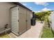 Backyard showing storage shed, air conditioner, and paver walkway at 12026 Crestridge Loop, New Port Richey, FL 34655