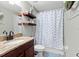 Bathroom features granite countertops, shelving, and modern fixtures at 12026 Crestridge Loop, New Port Richey, FL 34655