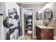 Bathroom features a granite countertop, updated vanity, and modern fixtures at 12026 Crestridge Loop, New Port Richey, FL 34655
