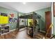 Spacious bedroom featuring a bunk bed, desk, and ample natural light at 12026 Crestridge Loop, New Port Richey, FL 34655