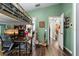 Bedroom with bunk bed, desk area, wood-look flooring, and green painted walls at 12026 Crestridge Loop, New Port Richey, FL 34655