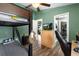 Bedroom features a bunkbed, a dresser with TV, and wood-look vinyl flooring at 12026 Crestridge Loop, New Port Richey, FL 34655