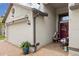 A charming front porch with brick pavers, patriotic decorations, and a two-car garage on a well-maintained home at 12026 Crestridge Loop, New Port Richey, FL 34655