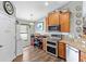 Bright kitchen with wooden cabinets and stainless steel appliances at 12026 Crestridge Loop, New Port Richey, FL 34655