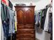 Spacious walk-in closet features custom shelving and plenty of space for clothing and accessories at 12026 Crestridge Loop, New Port Richey, FL 34655