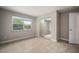 Bright bedroom with natural light, closet with mirrored sliding door, neutral walls and tile floor at 1217 W Terrace Dr, Plant City, FL 33563