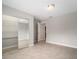 Bedroom with neutral paint, tile flooring and mirrored closet at 1217 W Terrace Dr, Plant City, FL 33563