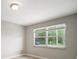 Neutral bedroom with a large window provides ample natural light at 1217 W Terrace Dr, Plant City, FL 33563