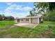 Charming single-story home with a cozy red door and attached garage on a corner lot at 1217 W Terrace Dr, Plant City, FL 33563