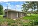 View of exterior with lush lawn, showcasing the home's setting at 1217 W Terrace Dr, Plant City, FL 33563