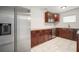 Kitchen featuring stainless steel appliances, granite countertops, and dark wood cabinets at 1217 W Terrace Dr, Plant City, FL 33563