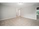 Open-plan living area boasts neutral paint, tile floors, and ample natural light at 1217 W Terrace Dr, Plant City, FL 33563