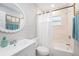 Bathroom with a white vanity, tile walls, and a shower-tub combination at 1312 S Evergreen Ave, Clearwater, FL 33756
