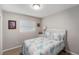 Cozy bedroom with a white wicker bed frame and beach-themed bedding at 1312 S Evergreen Ave, Clearwater, FL 33756