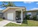 A cozy front porch area with seating, plants, and a welcoming entrance at 1312 S Evergreen Ave, Clearwater, FL 33756
