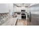 Updated kitchen featuring stainless steel appliances and white cabinets at 1312 S Evergreen Ave, Clearwater, FL 33756