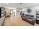 Open-concept living room with modern furniture and view of dining area and kitchen at 1312 S Evergreen Ave, Clearwater, FL 33756