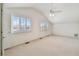 Bright bedroom with vaulted ceiling, ceiling fan, shuttered windows and lots of natural light at 13636 Lake Point S Dr, Clearwater, FL 33762