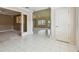 Open-concept dining room with tile floors, a ceiling fan, and access to adjacent living spaces at 13636 Lake Point S Dr, Clearwater, FL 33762