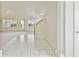 Inviting foyer with tile entry, staircase, and lots of natural light, creating a warm welcome at 13636 Lake Point S Dr, Clearwater, FL 33762