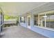 Relaxing screened lanai with tile floor, offering an enjoyable outdoor living space at 13636 Lake Point S Dr, Clearwater, FL 33762